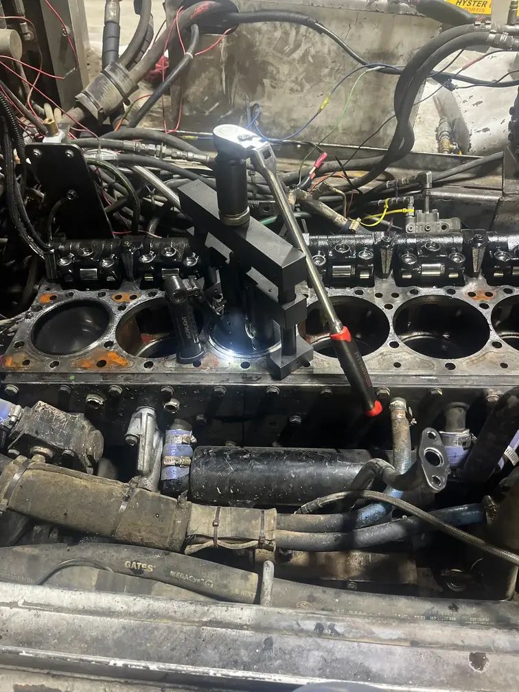 Spacious diesel repair shop bay with a truck on a lift